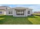 Rear view of a house showing a covered patio at 5753 Wallis Ln, St Cloud, FL 34771