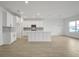 Spacious kitchen with white cabinets, large island, and tile flooring at 5753 Wallis Ln, St Cloud, FL 34771
