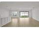 Bright and spacious living area with tile floors and sliding glass doors at 5753 Wallis Ln, St Cloud, FL 34771