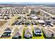 Aerial view of community with houses and pool at 5783 Greenery Ln, St Cloud, FL 34771