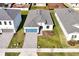 Aerial view of a house with gray roof and a blue garage door at 5783 Greenery Ln, St Cloud, FL 34771