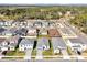 Aerial view of houses and community with empty lots at 5783 Greenery Ln, St Cloud, FL 34771