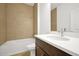 Bathroom boasts a large vanity, a shower/tub combo, and neutral tile at 5783 Greenery Ln, St Cloud, FL 34771