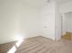 Bright bedroom with neutral carpet and double door closet at 5783 Greenery Ln, St Cloud, FL 34771