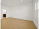 Bedroom with wood-look tile flooring and en-suite bathroom access at 5783 Greenery Ln, St Cloud, FL 34771