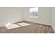Spacious bedroom with carpeted floors and a large window at 5783 Greenery Ln, St Cloud, FL 34771