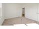 Bright bedroom featuring neutral carpeting and access to another room at 5783 Greenery Ln, St Cloud, FL 34771