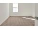Well-lit bedroom with carpeted floor and large window at 5783 Greenery Ln, St Cloud, FL 34771