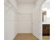 Spacious closet with wire shelving and wood-look tile floor at 5783 Greenery Ln, St Cloud, FL 34771