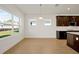 Dining area with view into kitchen and backyard access at 5783 Greenery Ln, St Cloud, FL 34771