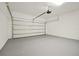 Clean and spacious garage with freshly painted floor and automatic opener at 5783 Greenery Ln, St Cloud, FL 34771