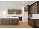 Modern kitchen with dark wood cabinets and island at 5783 Greenery Ln, St Cloud, FL 34771