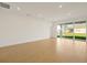 Open and spacious living area with sliding glass doors at 5783 Greenery Ln, St Cloud, FL 34771