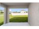 A beautiful green space is viewed from the covered back patio at 684 Se 65Th Ter, Ocala, FL 34472