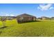 Spacious backyard with a large lawn, providing ample space for outdoor activities at 684 Se 65Th Ter, Ocala, FL 34472