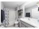Bright bathroom featuring a shower-tub combo and a sink with white countertop at 684 Se 65Th Ter, Ocala, FL 34472