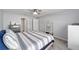 Bedroom featuring plush carpeting, soft lighting, and coordinated furniture at 684 Se 65Th Ter, Ocala, FL 34472