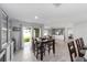 View from dining room that shows sliding glass doors to the back and views of kitchen and living area at 684 Se 65Th Ter, Ocala, FL 34472