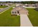 Charming single-Gathering home with a manicured lawn, neat flowerbeds, and a two-car garage at 684 Se 65Th Ter, Ocala, FL 34472