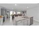 Open-concept kitchen with an island, stainless steel appliances, and easy access to the dining area at 684 Se 65Th Ter, Ocala, FL 34472