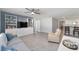 Inviting living room featuring a ceiling fan, modern furniture, and open access to the kitchen at 684 Se 65Th Ter, Ocala, FL 34472