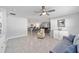 Spacious living room boasts an open floor plan, ceiling fan, and modern furnishings at 684 Se 65Th Ter, Ocala, FL 34472