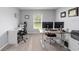 Spacious carpeted office featuring dual monitors and a large window for natural light at 684 Se 65Th Ter, Ocala, FL 34472