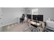 Spacious home office features dual monitors and a large window for natural light at 684 Se 65Th Ter, Ocala, FL 34472