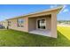 Covered patio with sliding glass doors, seamlessly blending indoor and outdoor living at 684 Se 65Th Ter, Ocala, FL 34472