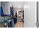 Walk-in closet with clothes, shoe racks, and shelves for optimal storage at 684 Se 65Th Ter, Ocala, FL 34472