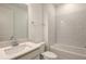 Modern bathroom featuring a white vanity, large mirror, subway tile, and a tub at 4412 Sw 84Th Street Rd, Ocala, FL 34476