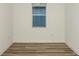 Bedroom with blinds on the window and hardwood floors at 4412 Sw 84Th Street Rd, Ocala, FL 34476