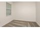 Bedroom features neutral carpet and a large window at 4412 Sw 84Th Street Rd, Ocala, FL 34476
