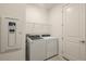 Laundry room featuring a washer, dryer, and storage shelves at 4412 Sw 84Th Street Rd, Ocala, FL 34476