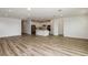 Open-concept living room with a kitchen, stainless steel appliances, hardwood floors, and recessed lighting at 4412 Sw 84Th Street Rd, Ocala, FL 34476