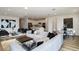 Open-concept living room featuring modern decor, kitchen with stainless steel appliances, and a dining area at 4412 Sw 84Th Street Rd, Ocala, FL 34476