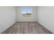 Simple bedroom with neutral carpeting and a large window at 4397 Sw 84Th Street Rd, Ocala, FL 34476