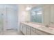 Luxurious bathroom featuring double vanity sinks, modern fixtures, and a tiled shower at 4457 Sw 84Th Street Rd, Ocala, FL 34476