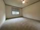 Bright bedroom with carpet flooring and ceiling fan at 7987 Lake James Blvd, Lakeland, FL 33810