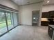 Bright dining room with sliding glass doors to the backyard at 7987 Lake James Blvd, Lakeland, FL 33810