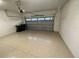 Two-car garage with epoxy flooring and automatic garage door opener at 7987 Lake James Blvd, Lakeland, FL 33810