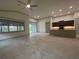 Open living area with tile floors and access to a patio at 7987 Lake James Blvd, Lakeland, FL 33810