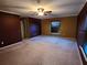 Large main bedroom with ceiling fan and neutral carpet at 9930 Se 67Th Avenue Rd, Belleview, FL 34420