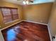 Bright bedroom with wood flooring and window blinds at 9930 Se 67Th Avenue Rd, Belleview, FL 34420