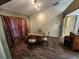 Dining room with dark wood floors and four chairs at 9930 Se 67Th Avenue Rd, Belleview, FL 34420