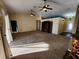 Spacious living room with high ceilings and carpeting at 9930 Se 67Th Avenue Rd, Belleview, FL 34420