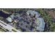 Community featuring multiple residential buildings and extensive parking surrounded by lush landscaping and green space at 3050 Pirates Retreat Ct # 502, Kissimmee, FL 34747