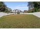 Large backyard with grassy area and white vinyl fence at 2724 Oxford St, Orlando, FL 32803