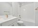 Clean bathroom, white vanity, gold fixtures, tub at 2724 Oxford St, Orlando, FL 32803