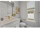 Stylish powder room with a single vanity and patterned floor at 2724 Oxford St, Orlando, FL 32803